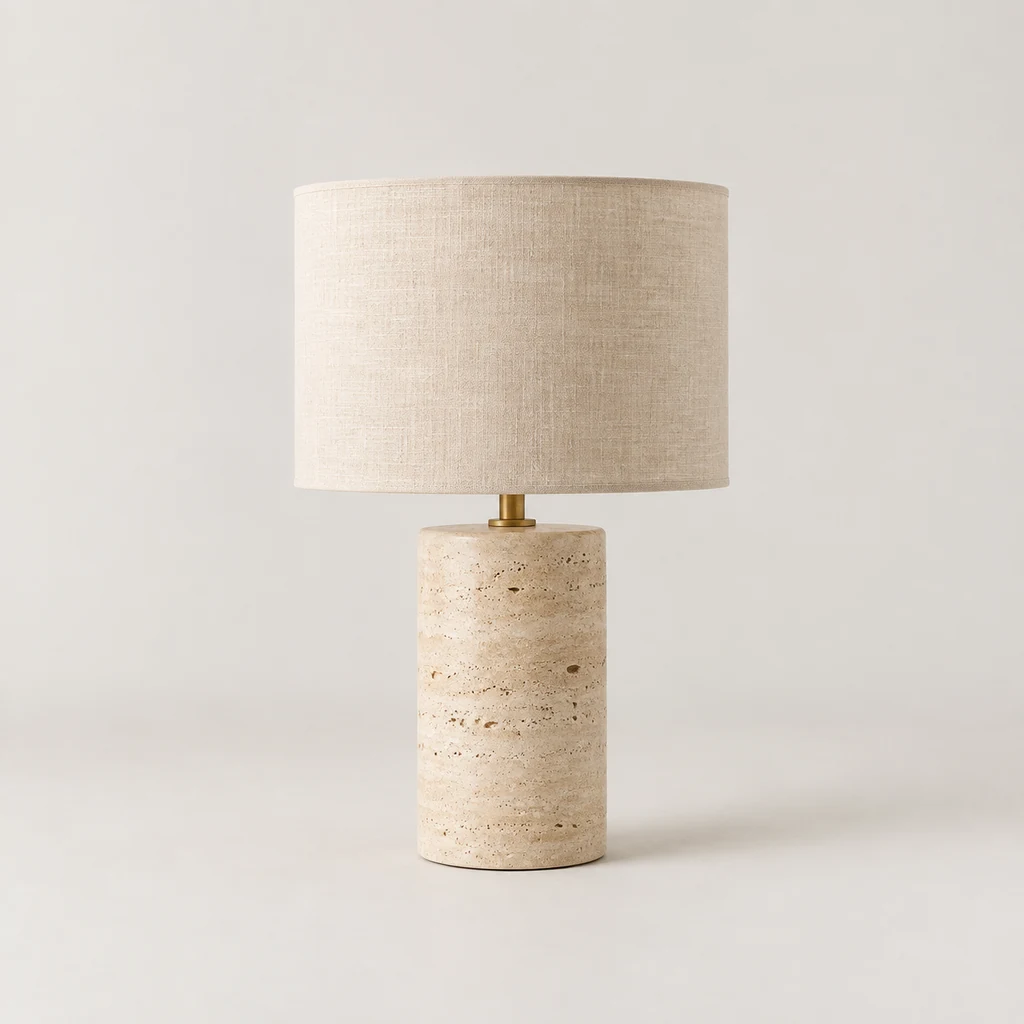 Table lamp with a cylindrical travertine base and linen drum shade