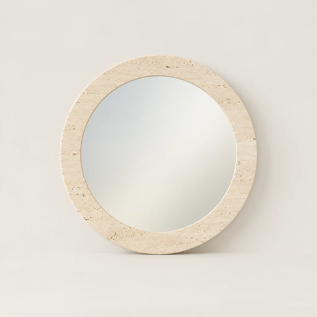 Round mirror framed in a wide ring of cream travertine